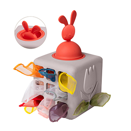 Taf Toys gray sensory cube with a red pop-up bunny and colorful tissues