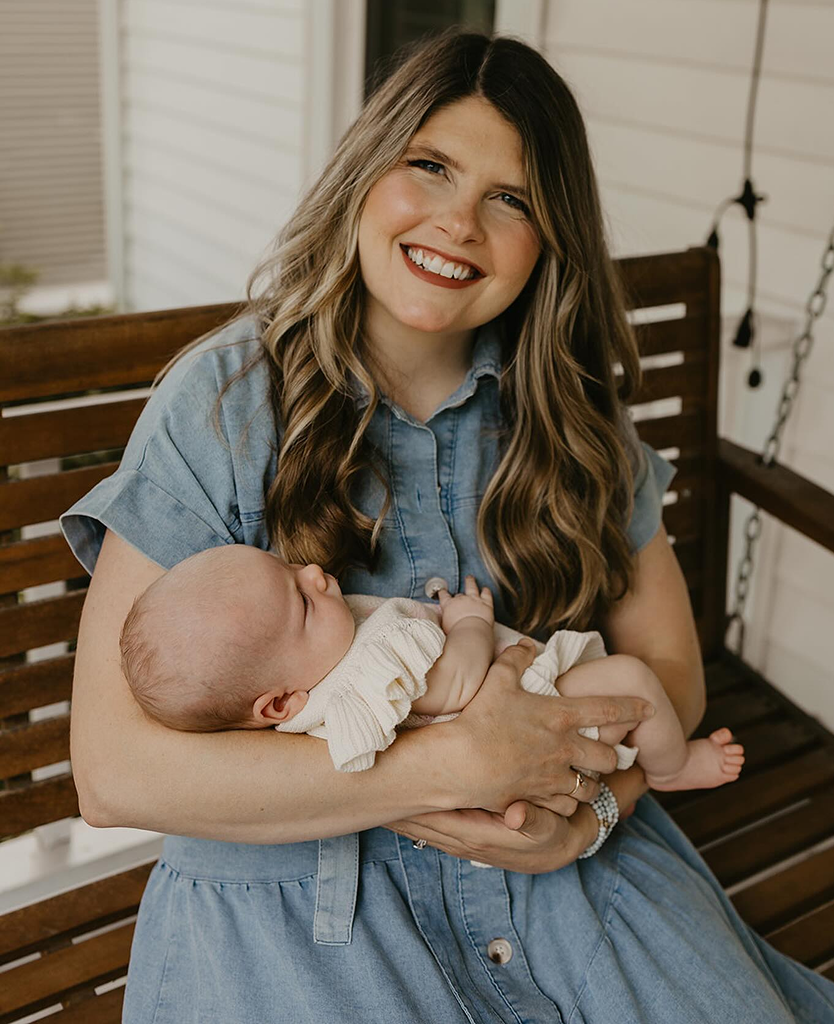 Bekki holding her baby, from the existing app photo